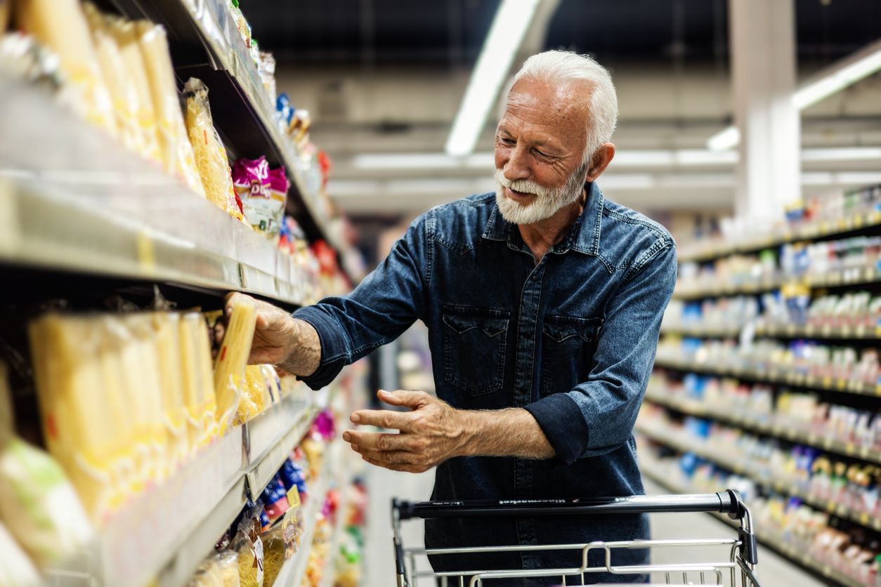 older man shopping for groceries
