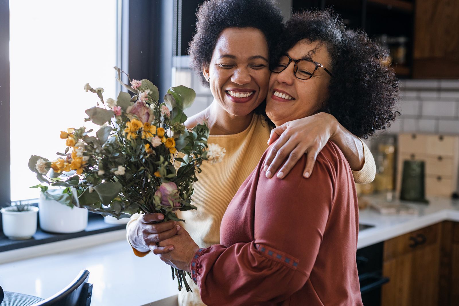 two women with flowers