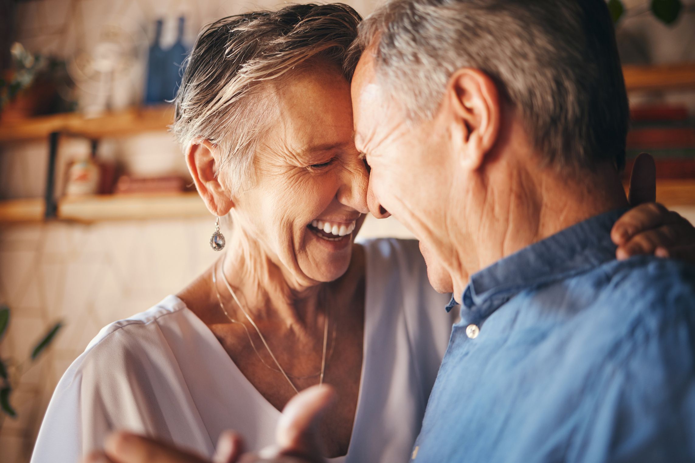 older couple laughing and dancing