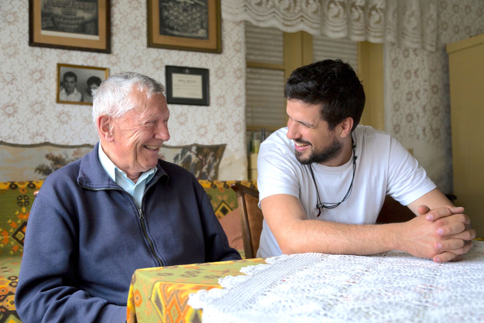 older-adult-man-with-adult-child-laughing