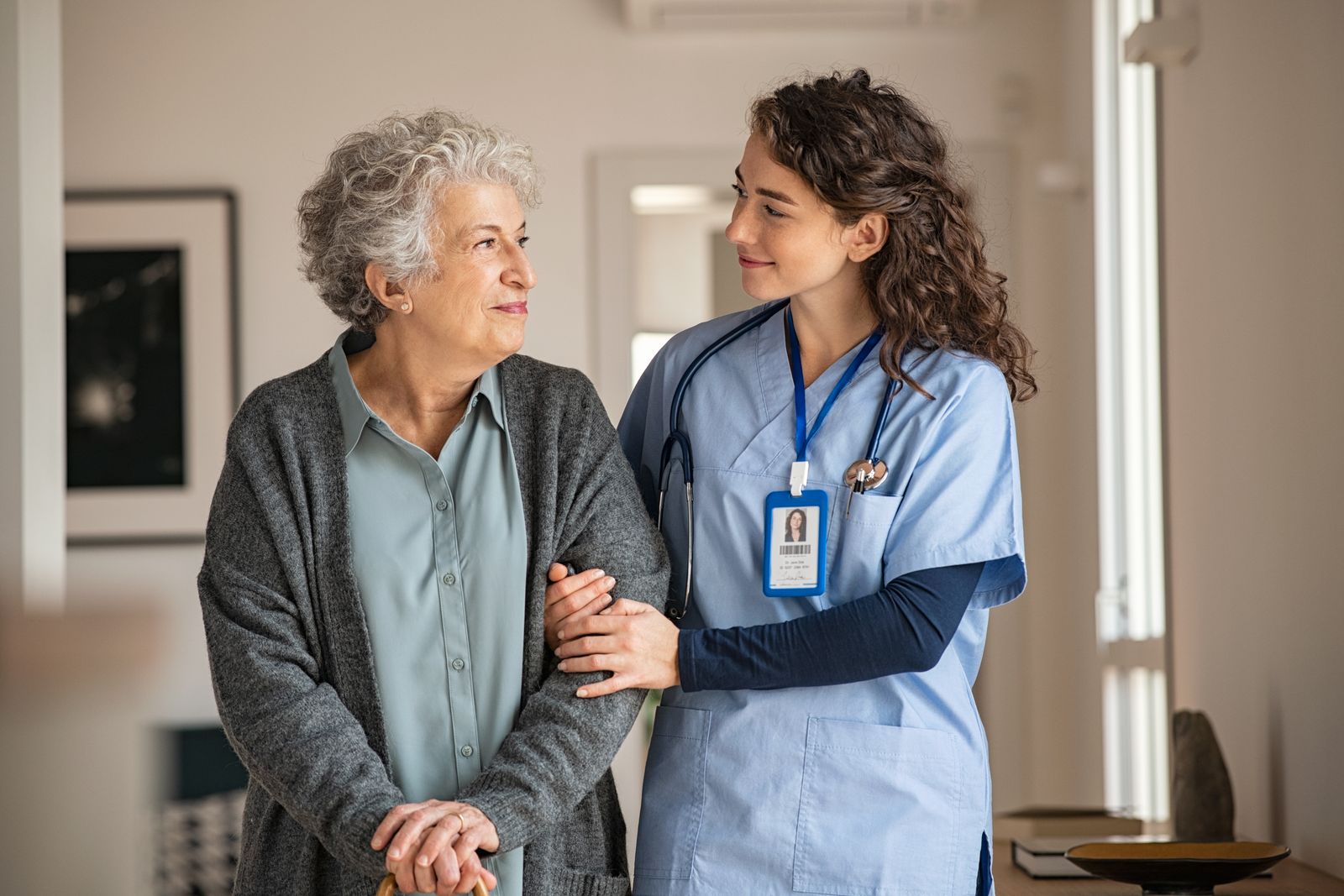 Older-woman-looking-at-nurse