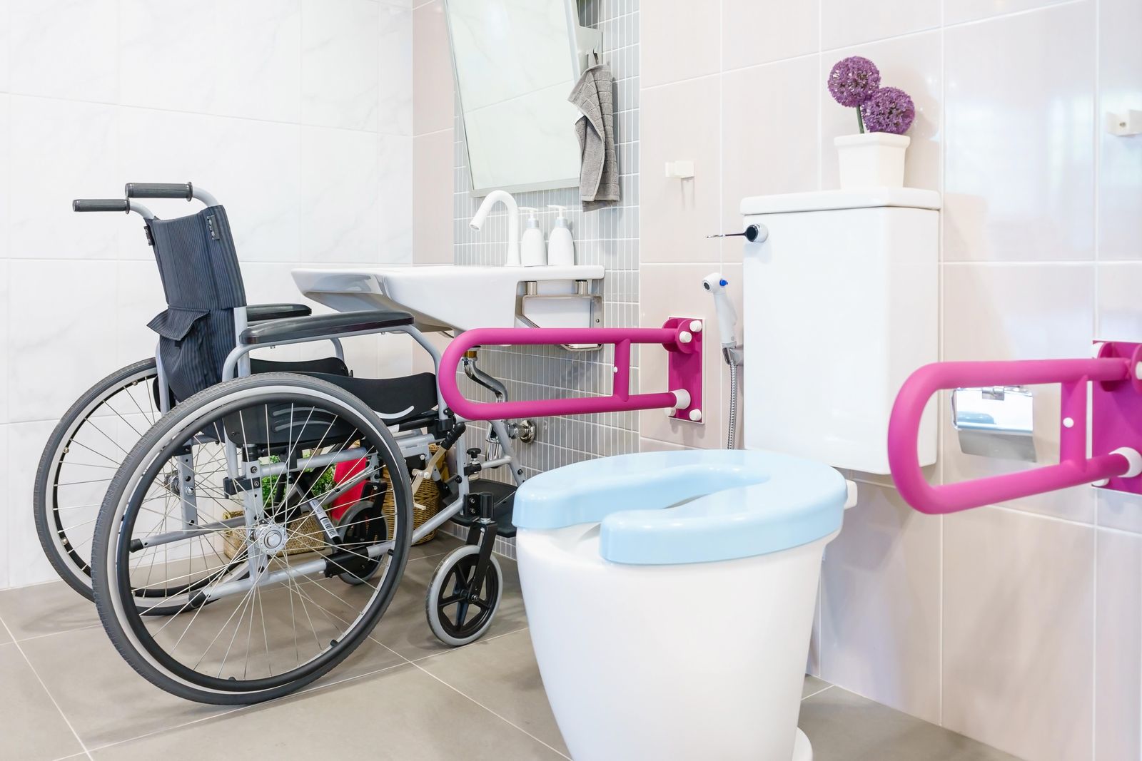 Toilet with arm rails