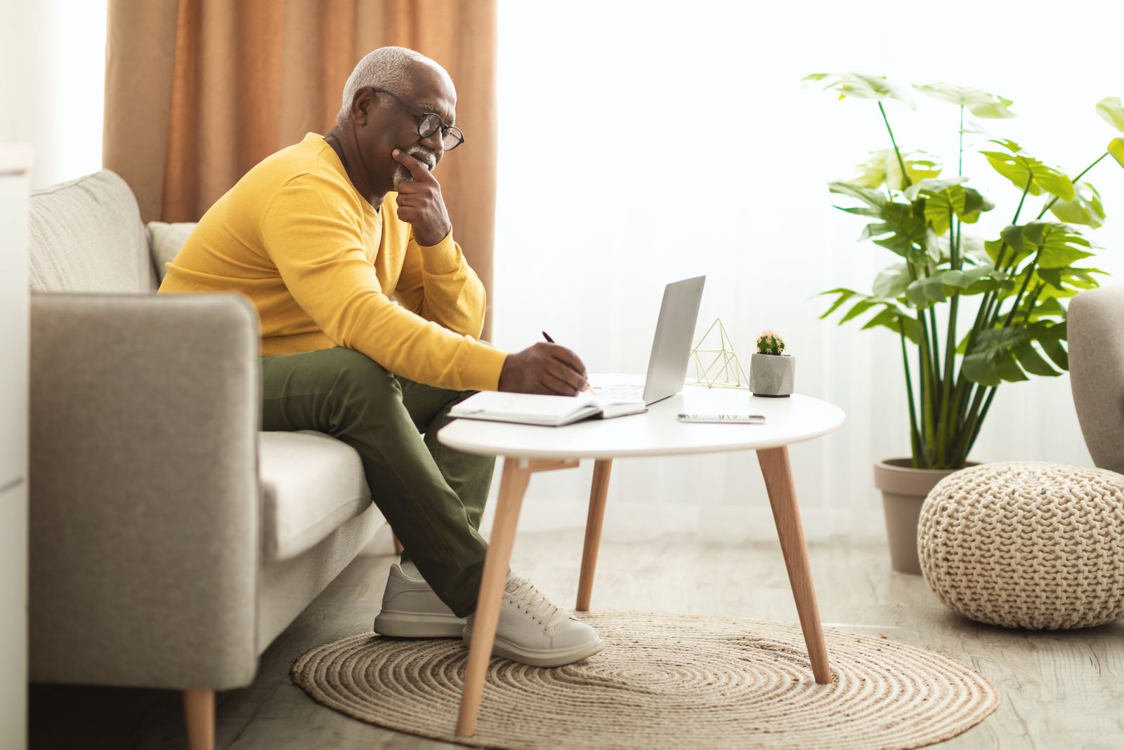 older adult thinking at computer