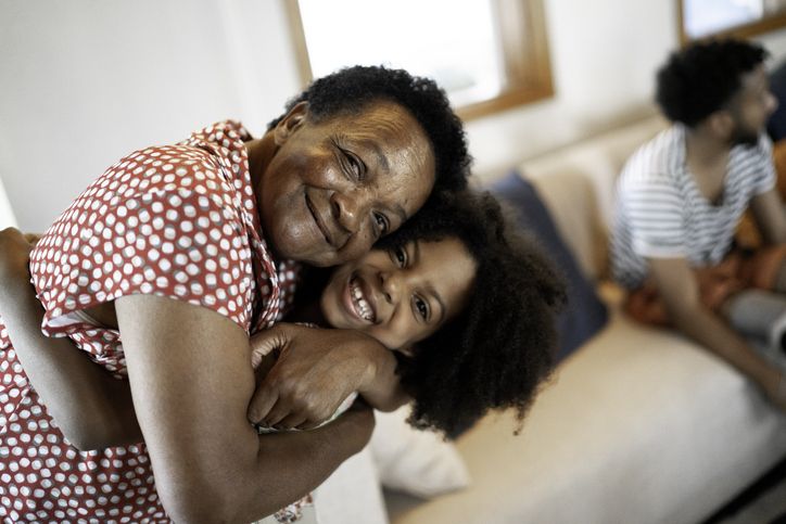 Older woman and child hugging sideways
