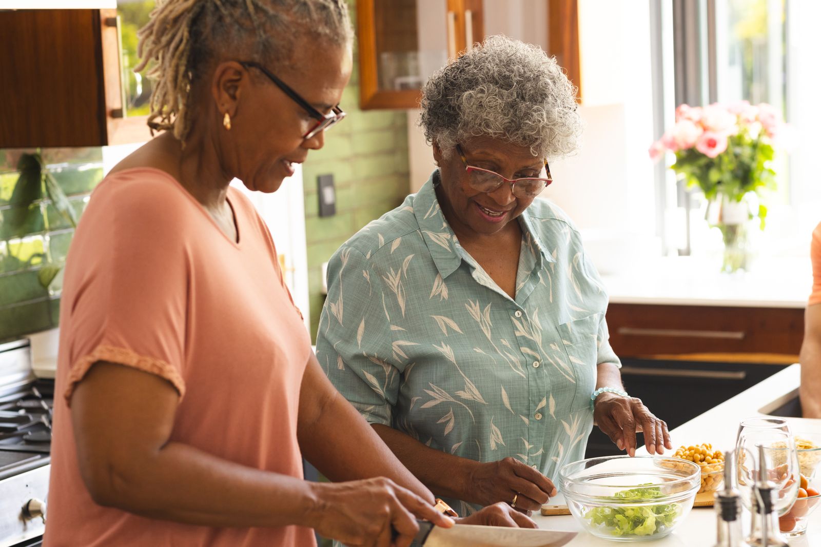 adult-child-and-older-adult-prepping-food-in-kitchen